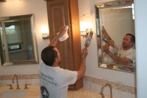 Seal Out Scorpions specialist sealing gaps in a bathroom to prevent scorpion entry.