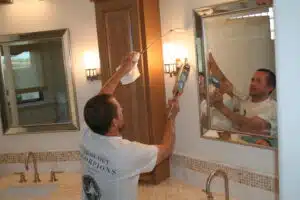 Seal Out Scorpions specialist sealing gaps in a bathroom to prevent scorpion entry.