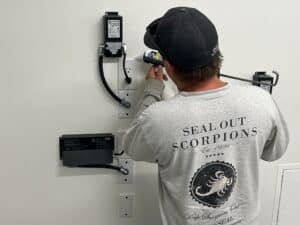 Technician performing Systemic Sealing for scorpion prevention