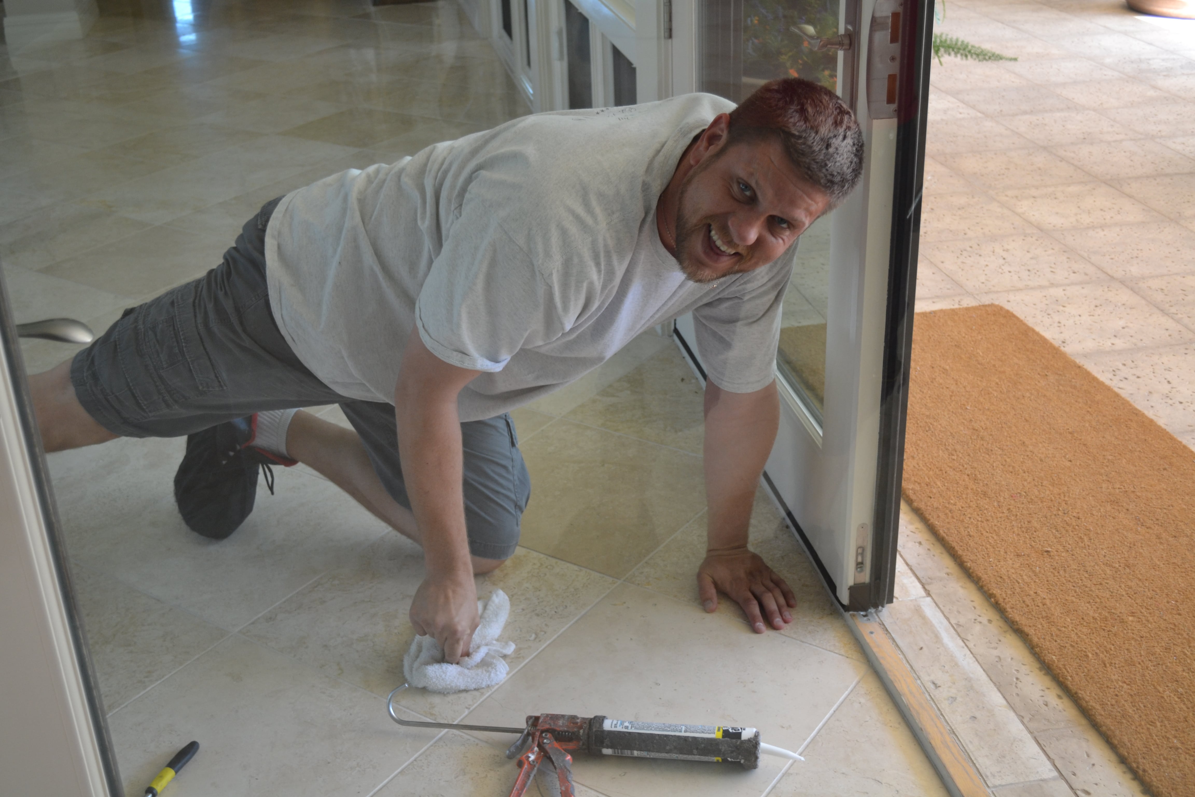 Mike sealing homes to ensure protection, using caulk for scorpion control