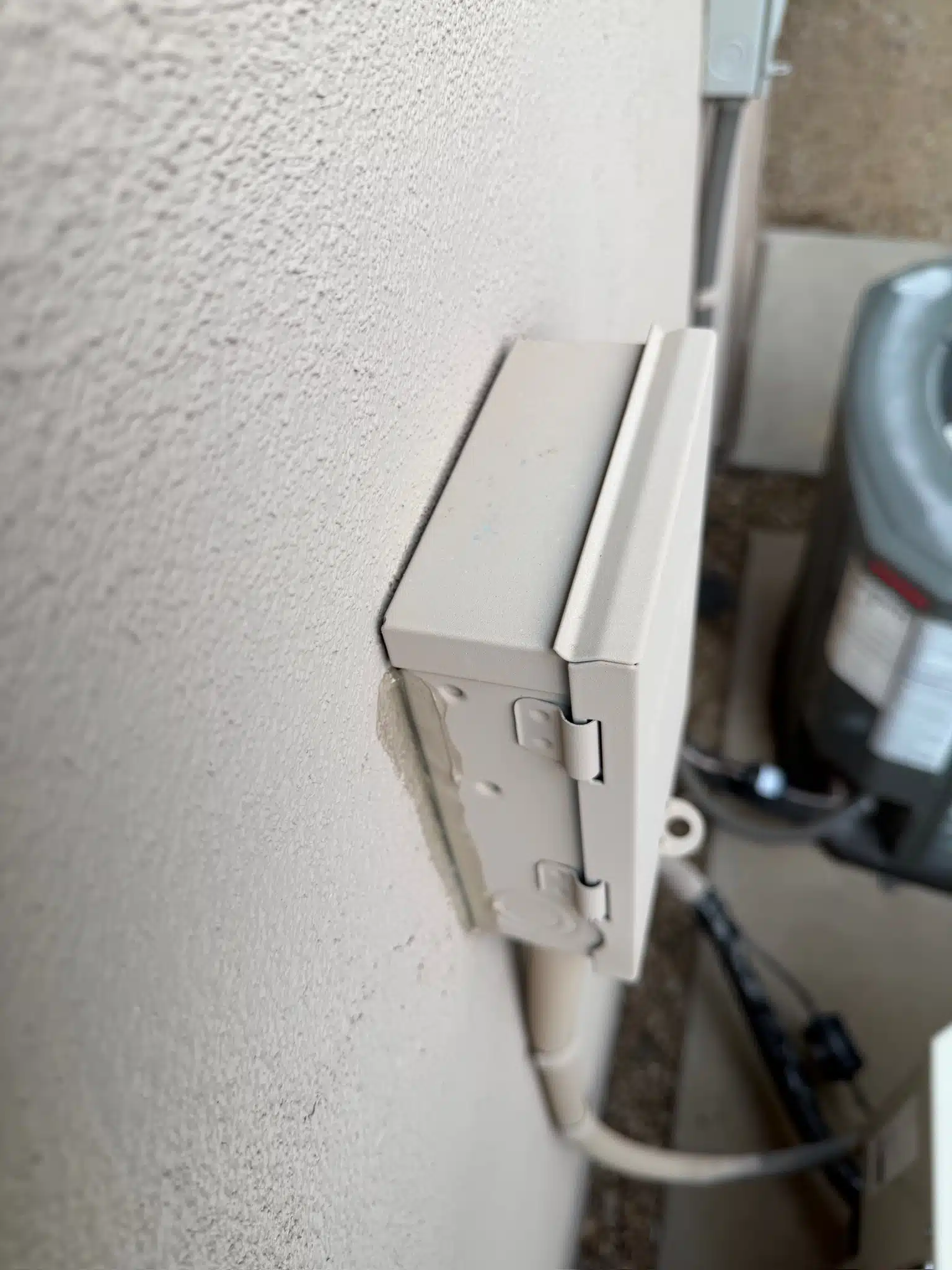 Poorly sealed exterior electrical box creating entry point for scorpions