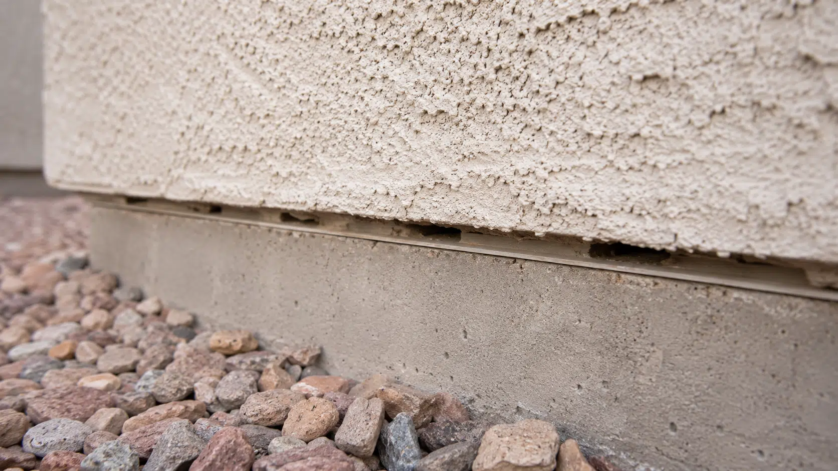 Close-up of scorpion barrier gaps showing Arizona summer survival pathways